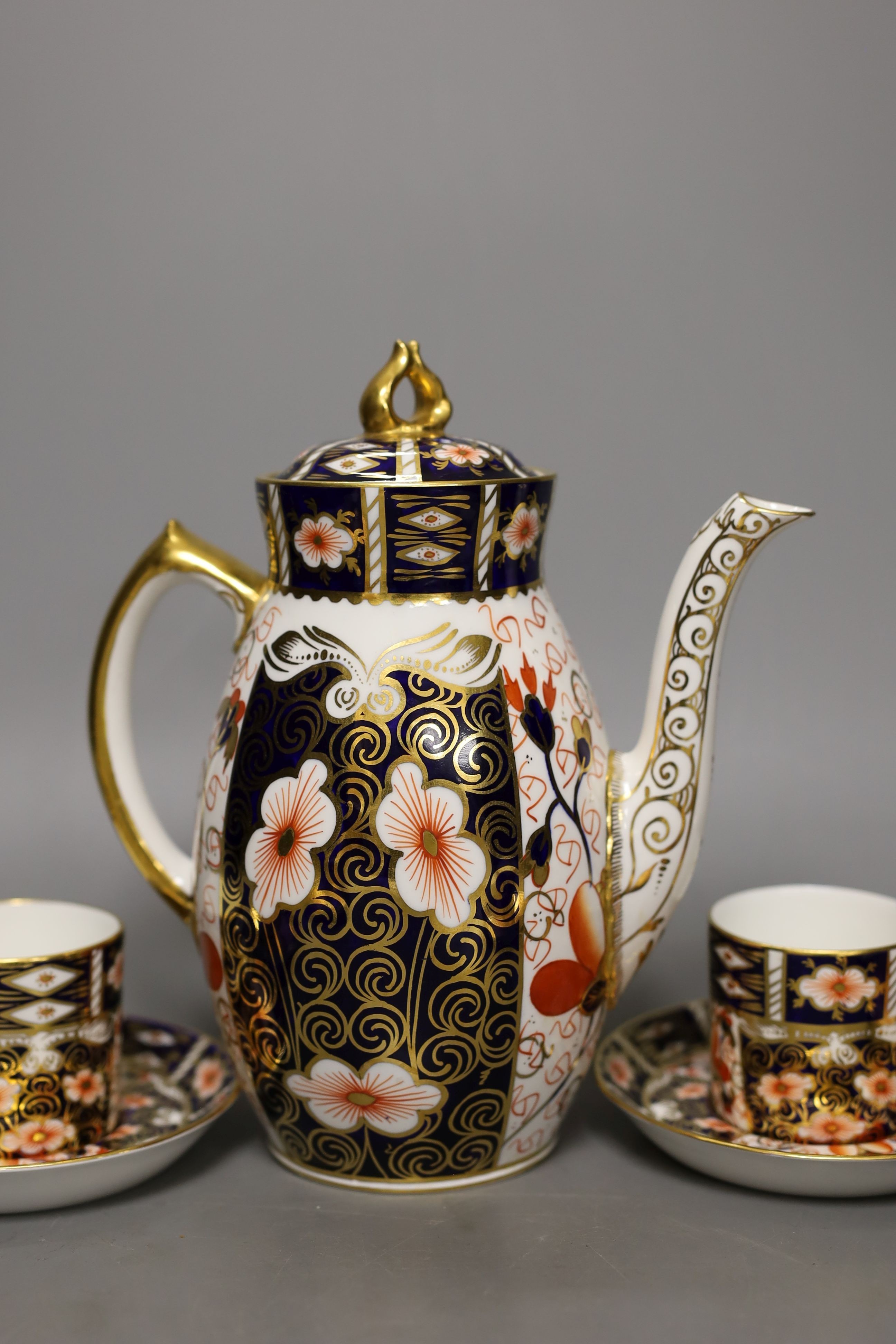 A Royal Crown Derby Imari pattern 2451 coffee set, comprising coffee pot, bowl jug and six cups and saucers.